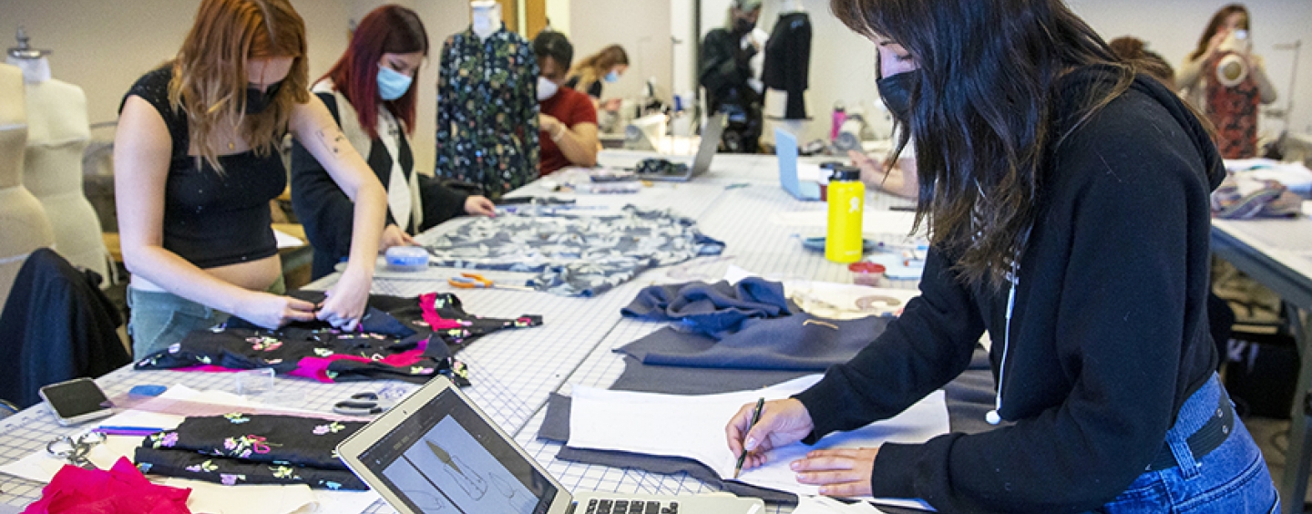 Apparel design students constructing their garments in a classroom