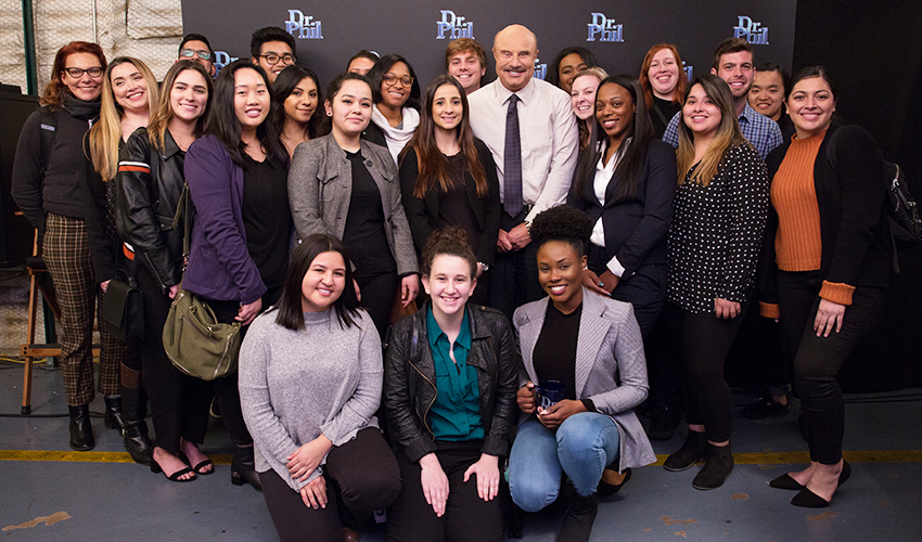 Dr. Phil McGraw with his show’s interns and staff, many of whom are SF State alum and students.