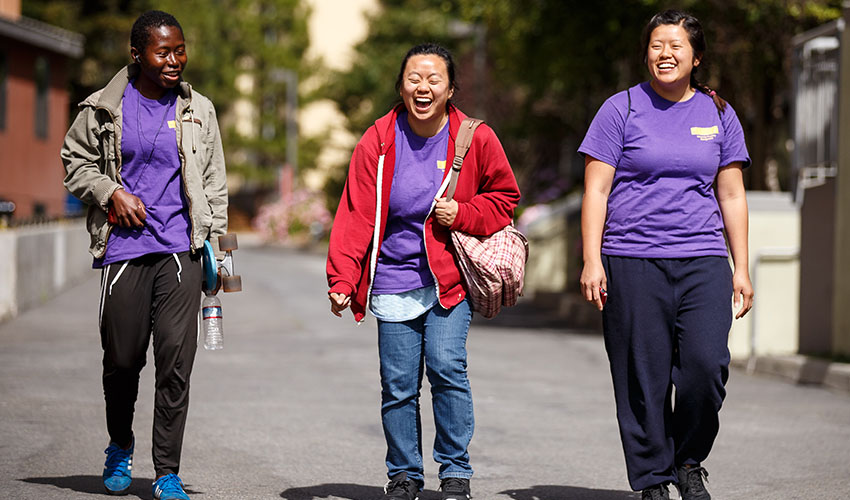 Three SF State students walking on campus