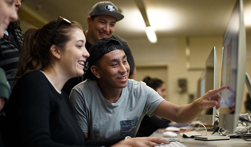 A group of students working on computer