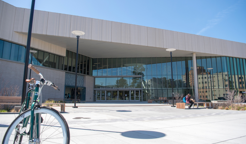 Concrete and glass building with a bicycle in the foreground