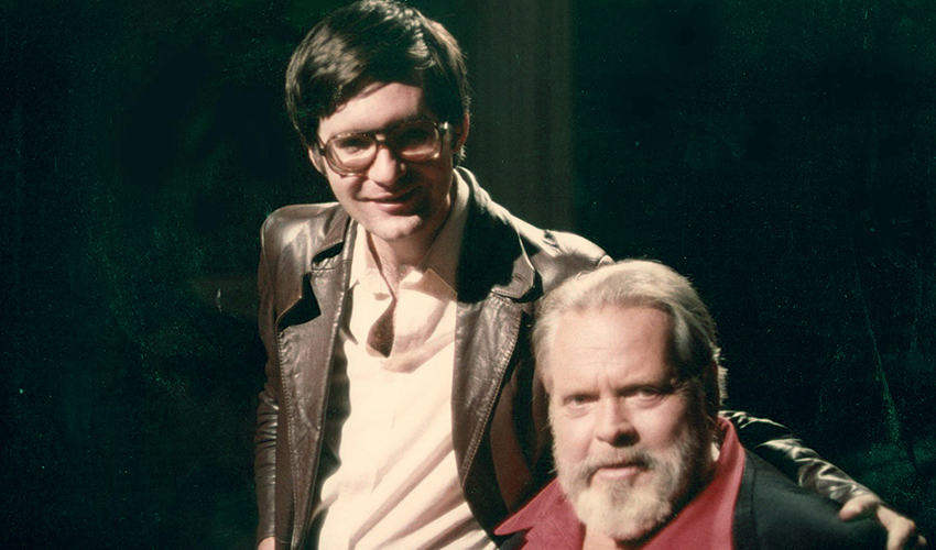 SF State Professor Joseph McBride on the set with legendary filmmaker Orson Welles.