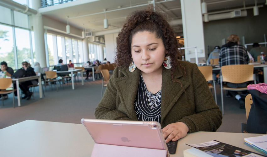 Student on laptop in the SF State J. Paul Leonard Library