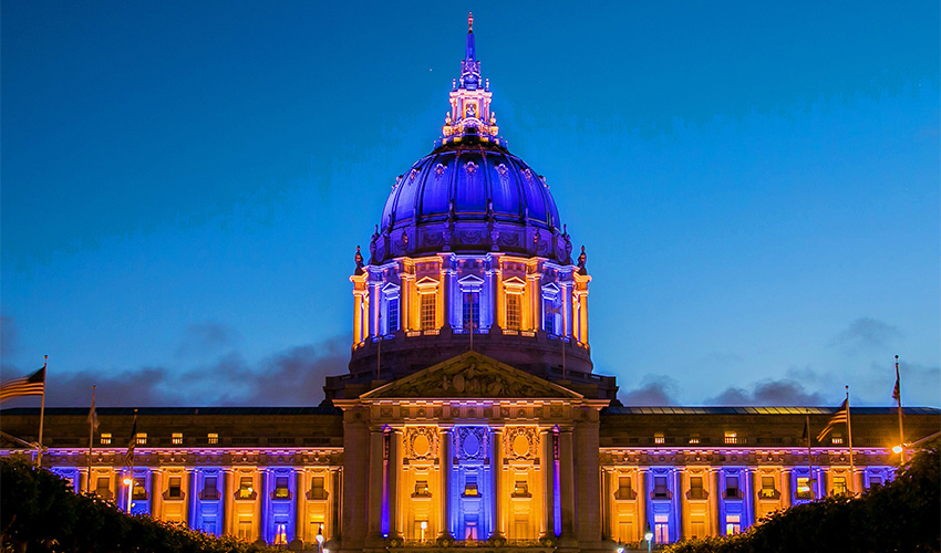 City Hall lit up with Purple and gold lights