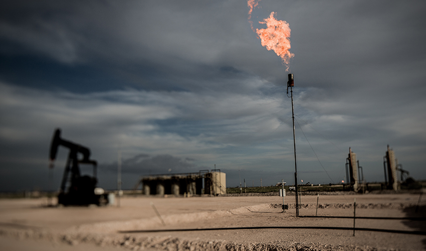 Natural gas is flared off from an oil well.