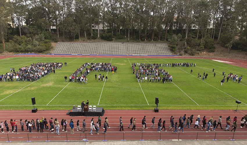 Students forming SFSU on the Cox Stadium stadium
