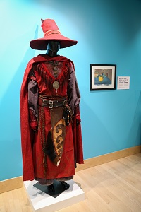 An elaborately decorated red wizard costume