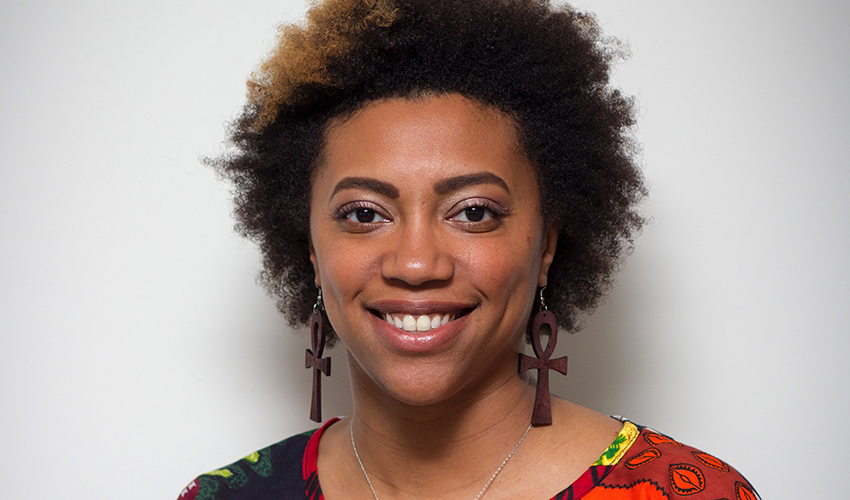 Woman smiling against a white background