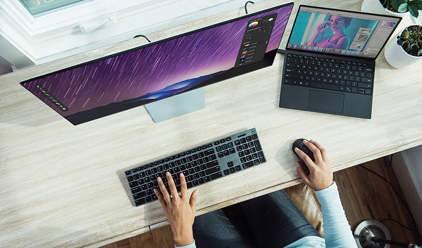 Aerial view of a person sitting at a desk using a computer.