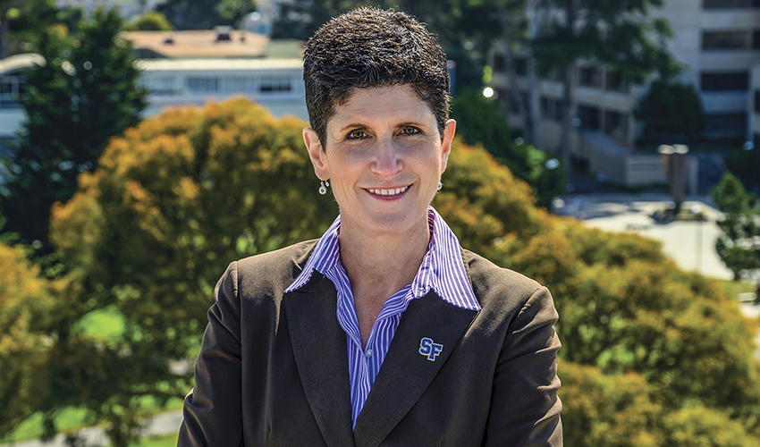 Woman in blazer smiling