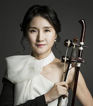 Eunah Noh holding a haegeum in a studio headshot
