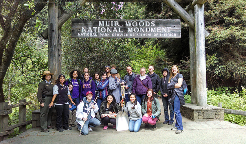 San Francisco State Rec, Parks & Tourism students get ready to restore a trail at the entrance to Muir Woods.