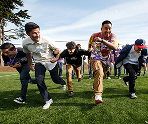 A group of SF State students run in a race.