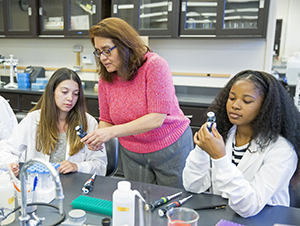 Student Natalie Warren, from left, Professor of Biology Leticia Marquez-Magana and student Joi Lee in the Health Equity Research (HER) Lab at SF State