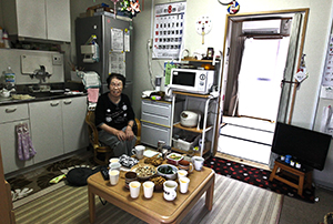 A photo of Fukushima City, Japan resident Tomiyo Fujii in her home.