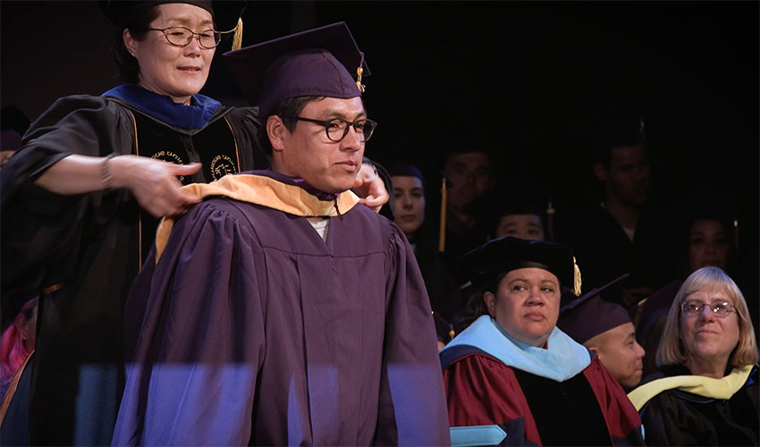 David receives his master’s degree in molecular biology from SF State’s College of Science and Engineering during the Commencement ceremony in May 2017.