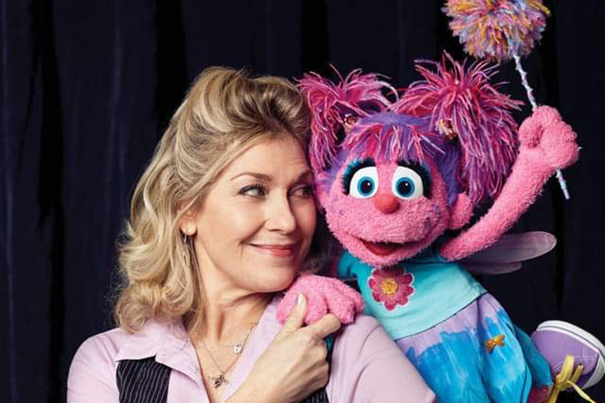 Leslie poses next to the fairy muppet Abby Cadaby