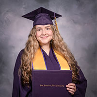 Headshot of Nicole dress in regalia