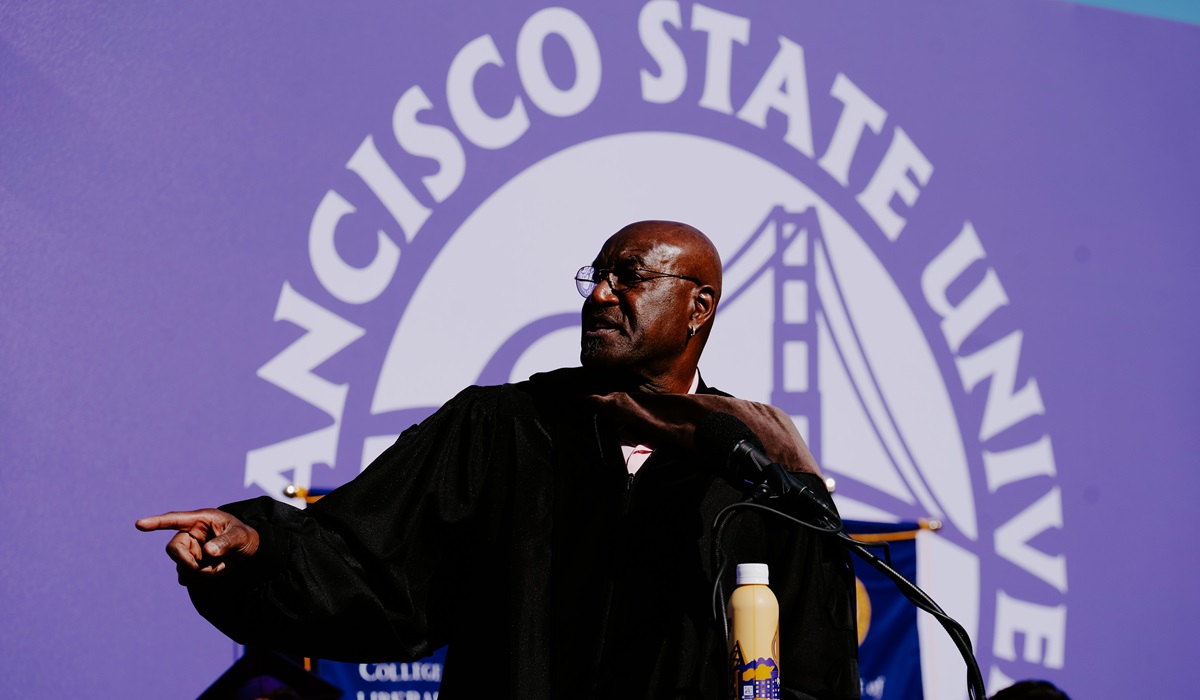 Delroy Lindo gestures on stage at Commencement