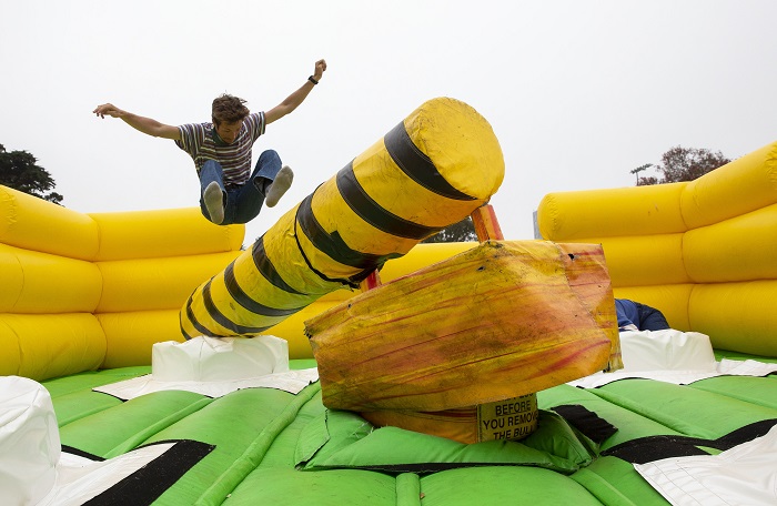 A student jumps on an inflatable thing