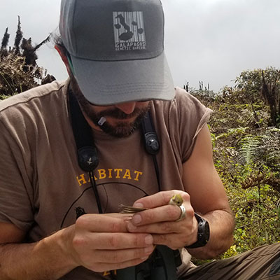 Jaime Chaves collecting sample from bird