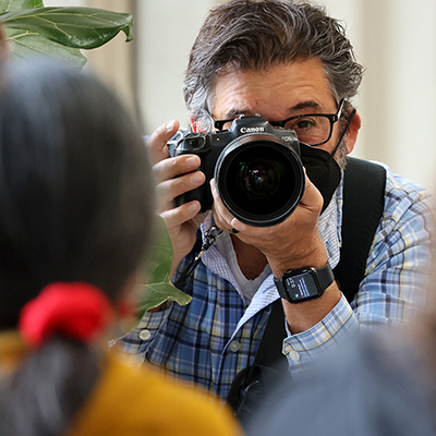 Kevin Painchaud holds a camera 