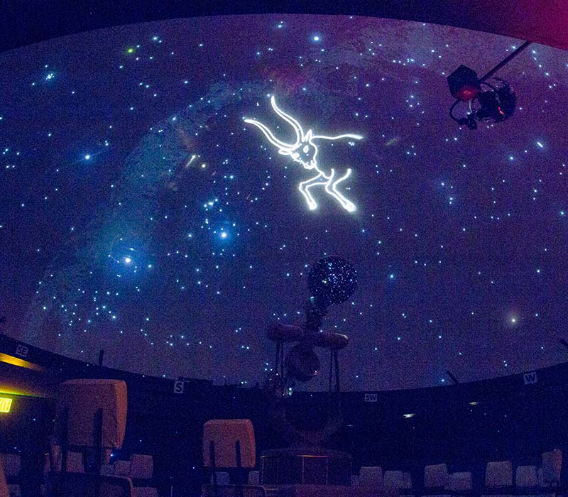 Planetarium dome with a projection of stars and a constellation