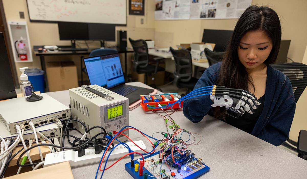 Student working on bionic hand project in Quintero lab