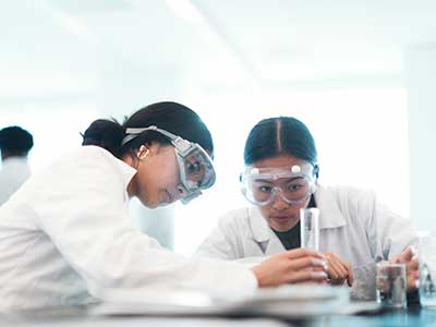 Two chemists working in a lab