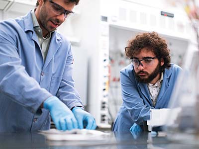 Two chemists working in the lab