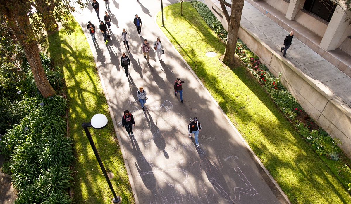 Students walk onto campus