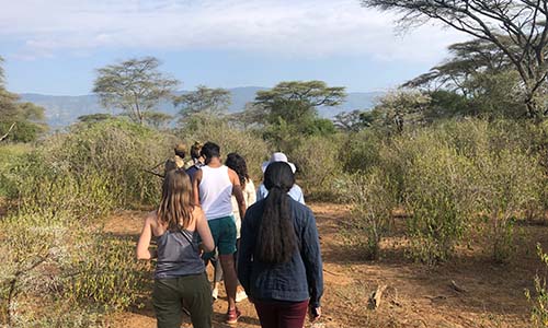 Students walking on a nature hike in Kenya