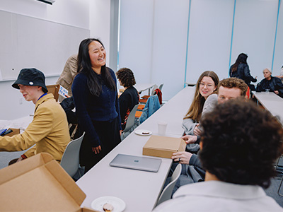 Students chatting and laughing during an event