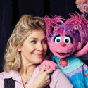 Leslie poses next to the fairy muppet Abby Cadaby