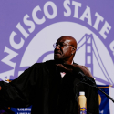 Delroy Lindo gestures on stage at Commencement