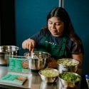 Woman whisking salad dressing