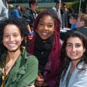 Three students smile at the camera