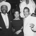 Wesley Johnson, a woman and blues musician T-Bone Walker pose for a picture while standing inside the Texas Playhouse nightclub