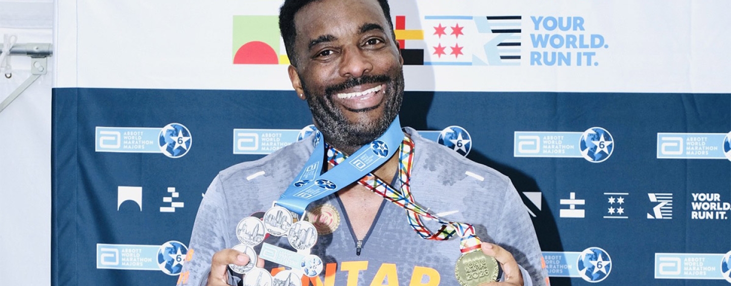 Antar Johnson poses with the six star medal and the Tokyo marathon medal