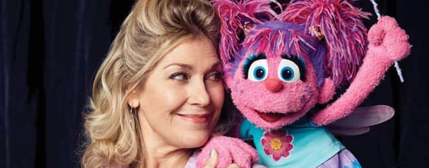 Leslie poses next to the fairy muppet Abby Cadaby
