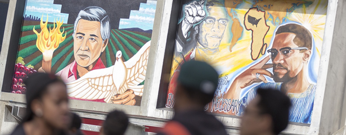 A mural on SF State’s student center depicting Cesar Chavez and Malcolm X.