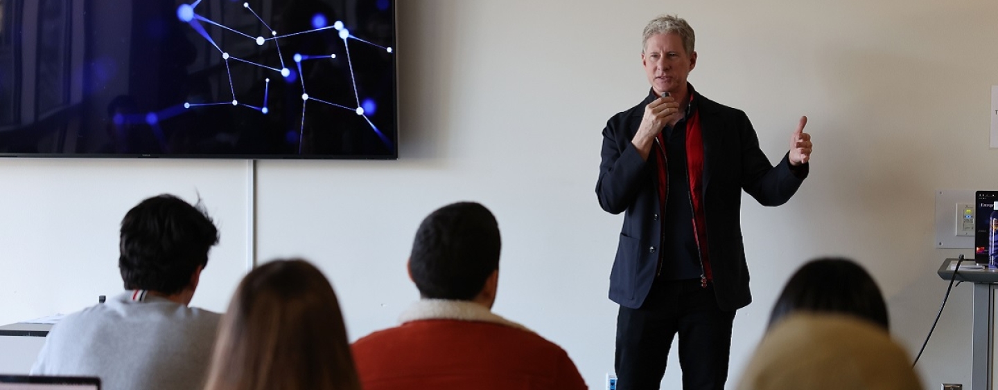 Chris Larsen talks to students