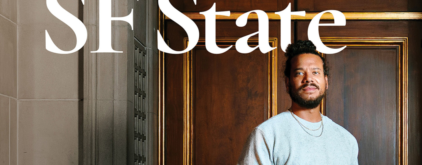 The SF State Magazine spring/summer 2026 issue cover photo of Ryan Marchand standing in front of a wooden door while wearing a gray sweatshirt