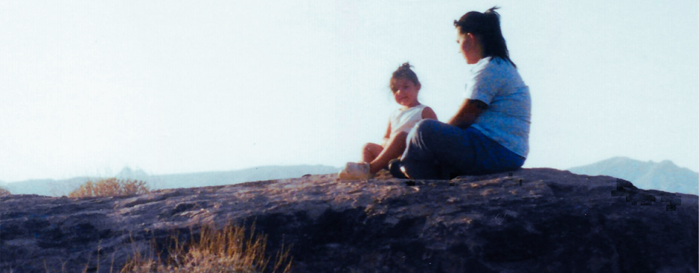 Cecelia Mellieon and her daughter sit outdoors at Fortaleza Indian Ruins, homeland of their ancestors, near the Tohono O’odham Nation’s San Lucy Village outside of Gila Bend, Arizona. 