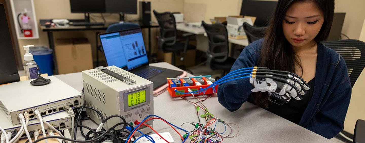 Student working on bionic hand project in Quintero lab