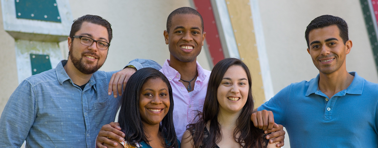 Five students smiling at camera