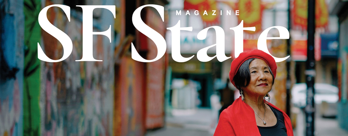 The cover of SF State Magazine featuring a photo of Genny Lim standing in an alley in San Francisco while wearing a red beret, red coat and black shirt