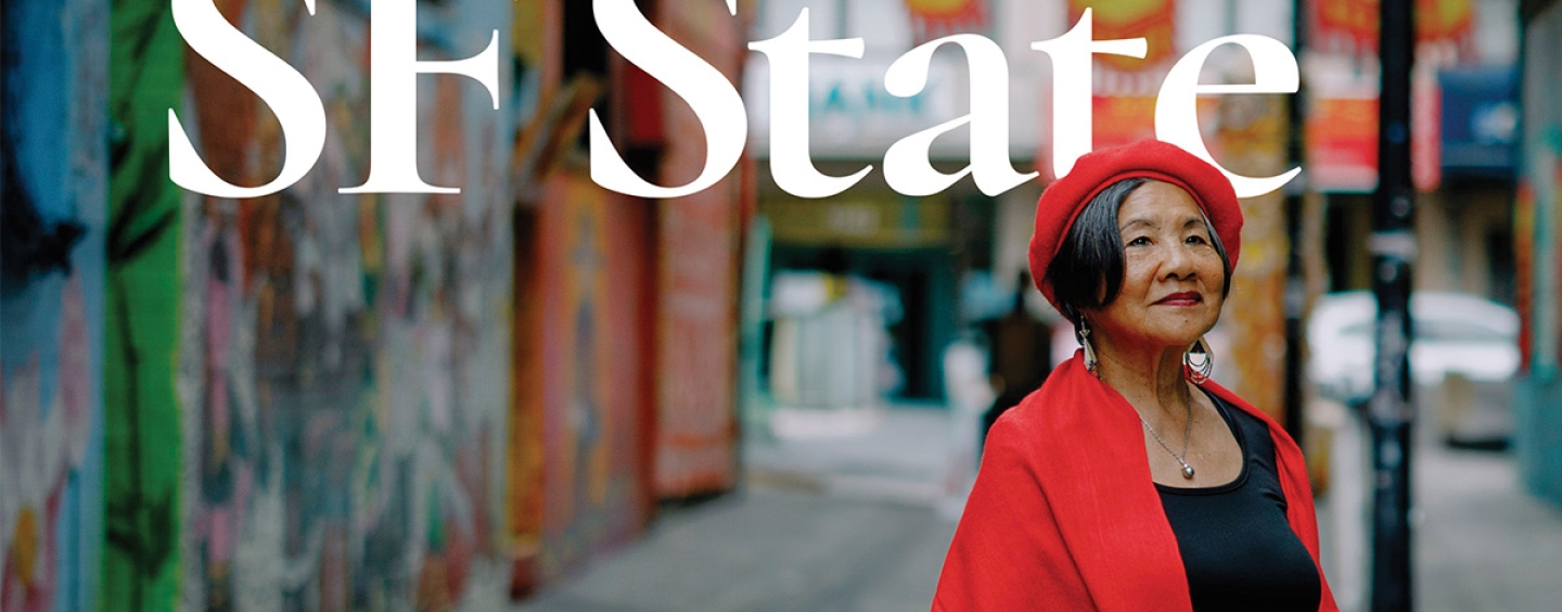 The cover of SF State Magazine featuring a photo of Genny Lim standing in an alley in San Francisco while wearing a red beret, red coat and black shirt