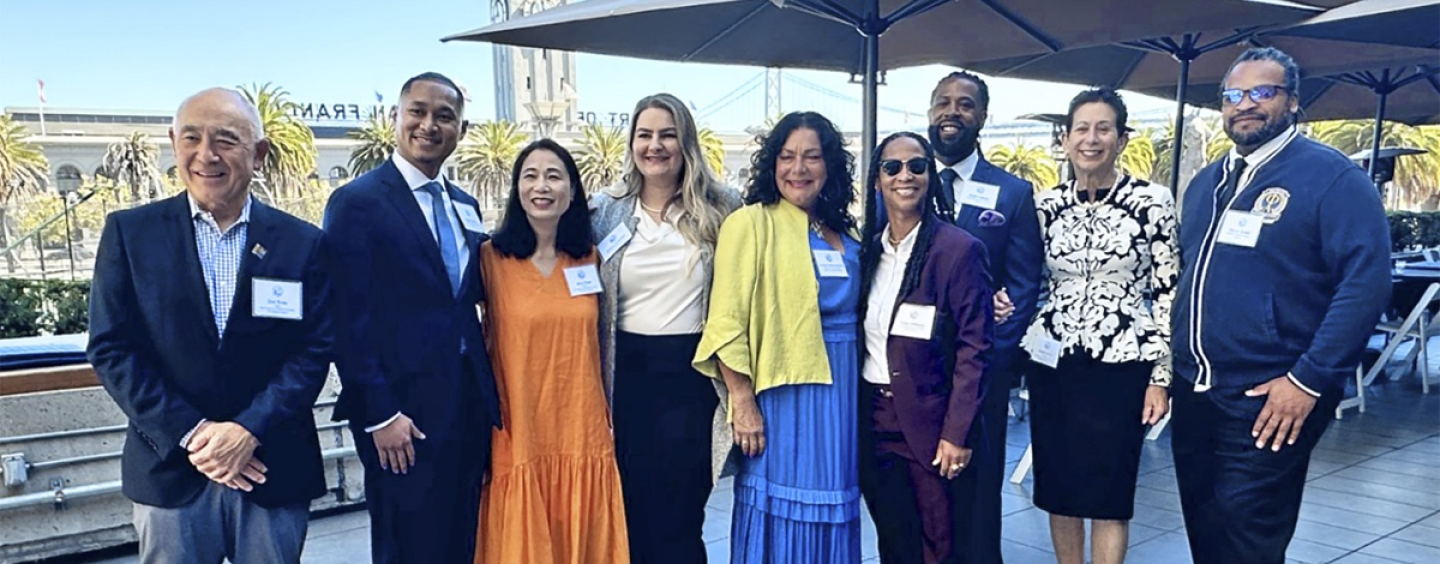 Men and women smile at the Guardian Scholars luncheon