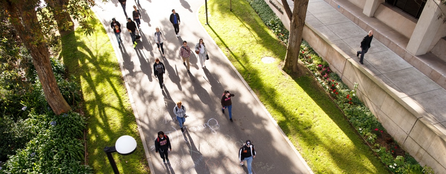 Students walk onto campus